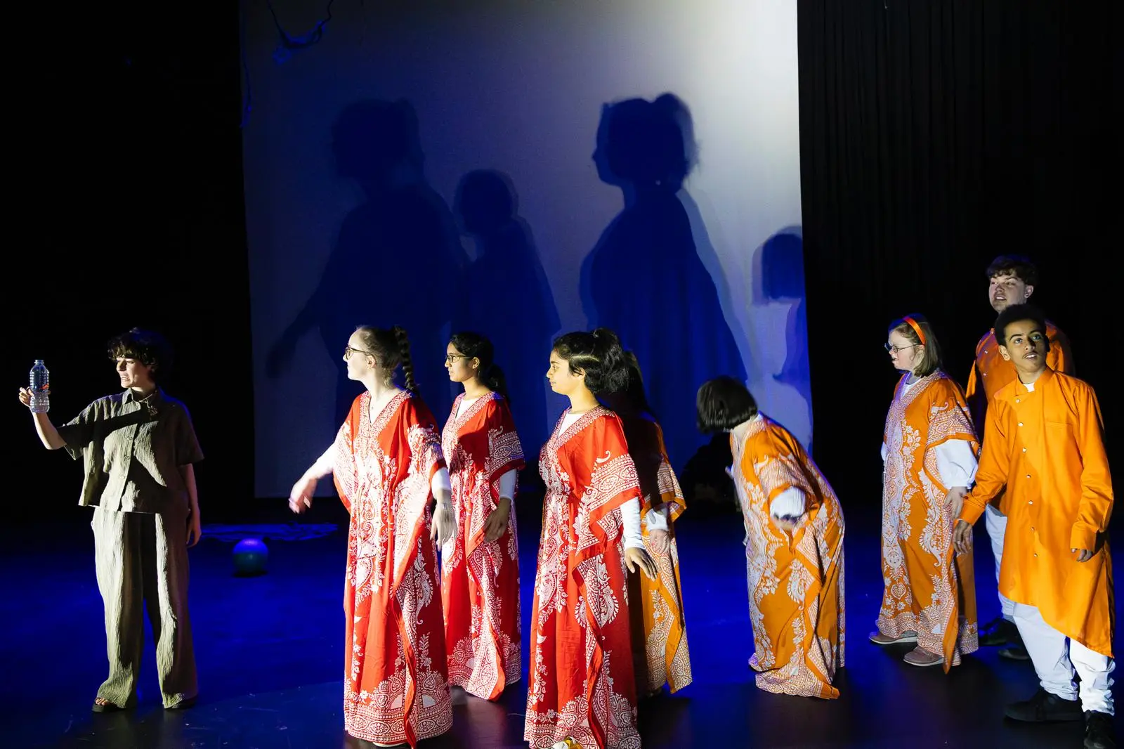 WhatsApp Image 2025-04-29 at 11.25.21 Mia and the fish with actors in red and orange saris