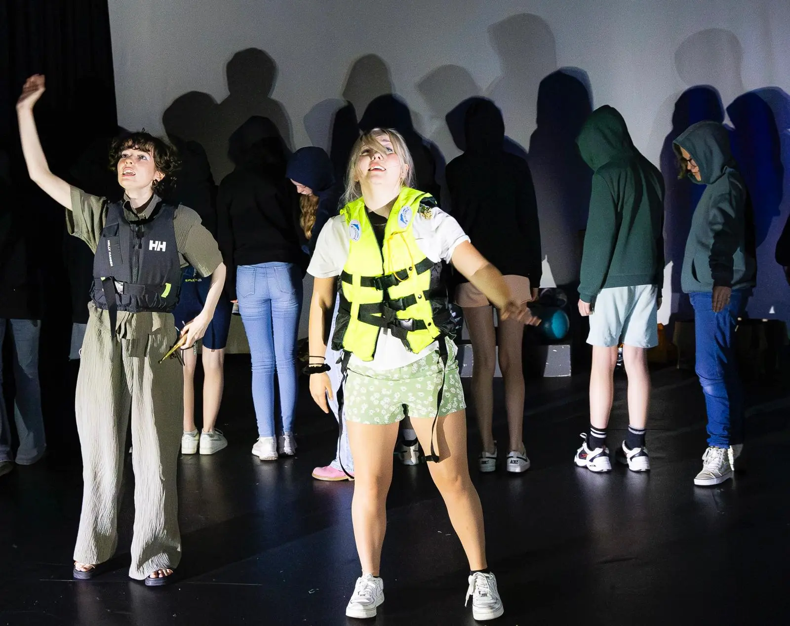 WhatsApp Image 2025-04-29 at 21.46.39 (1) 2 actors playing refugees, wearing life jackets, in a scene from Mia and The Fish