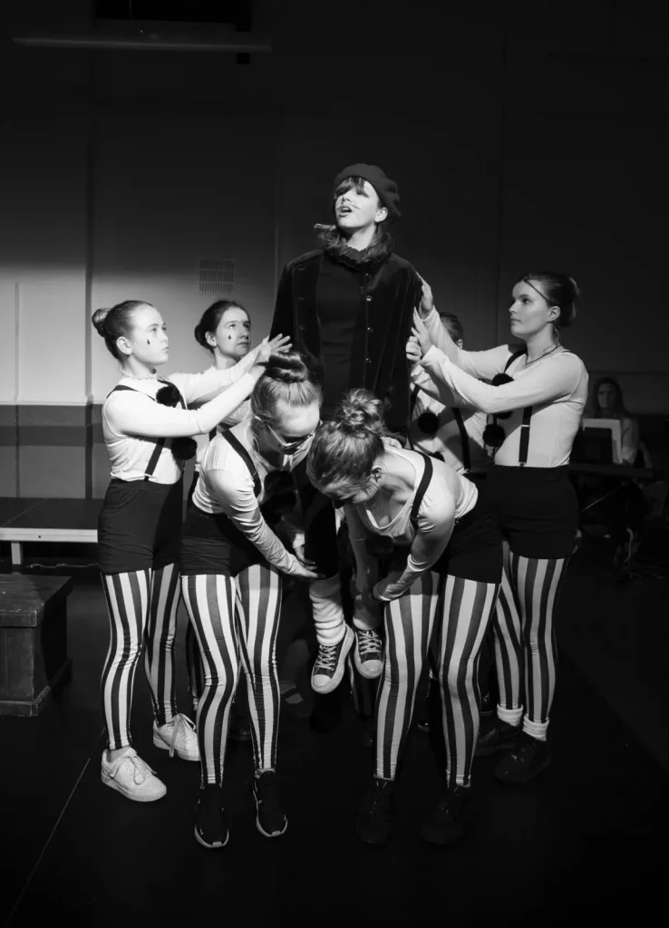 mime troop dressed in black and white in Shakespeare's 12th