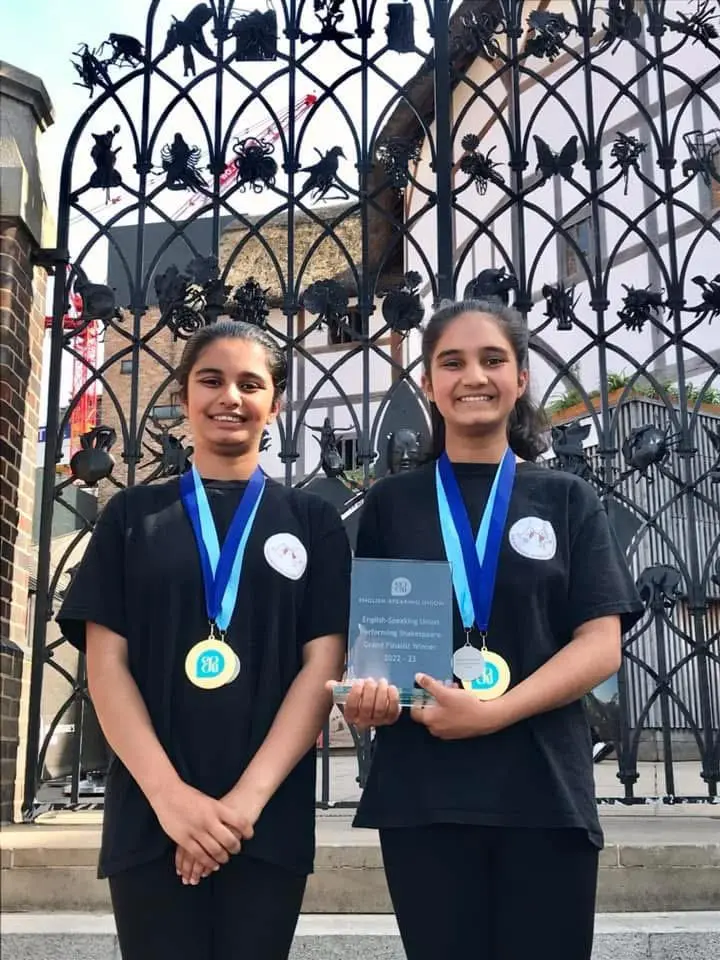 ESU 4 The girls wearing their winning medals and holding their certificates outside Shakespeares Globe in London